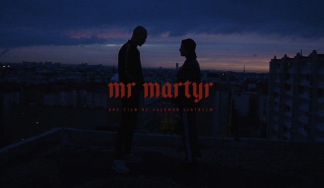 Two figures on a rooftop at dusk, documentary still