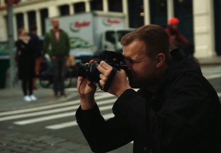 Street photographer at work, Decathlon Suisse SS26 campaign